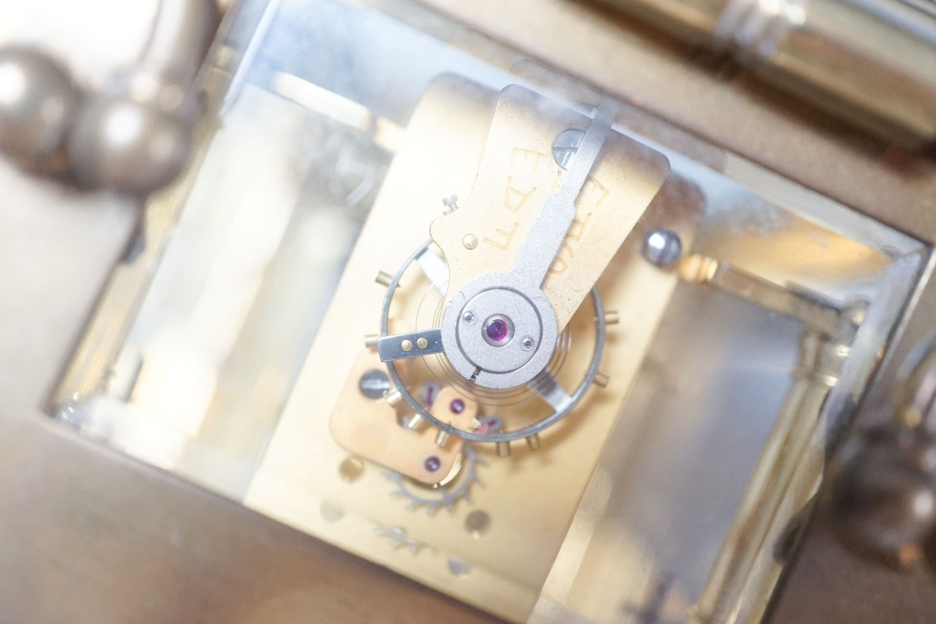 A brass carriage timepiece and key 12cm